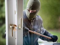 burglar breaking in through screen door