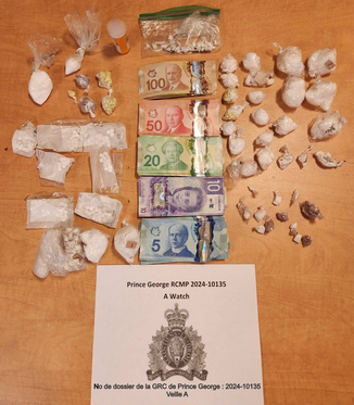 Photo of the drugs and cash found in the black cases. 