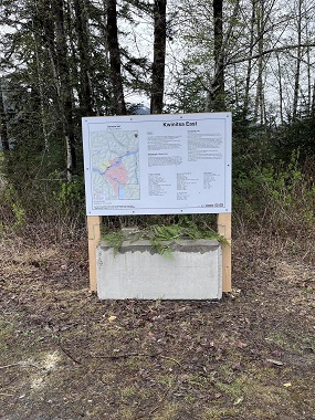 Kwinitsa sign with the cedar cut from the sign