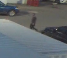 Suspect on video surveillance wearing dark hat and dark clothing associated to theft of truck from Ford in Trail, BC