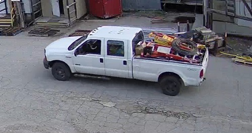 Surveillance footage of the suspect vehicle, Ford F-350, white.