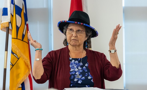 Picture of Cowichan Tribes Chief Cindy Daniels giving a speech and land acknowledgement.