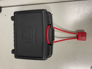 black Ecotech hard plastic box with a bright red lock