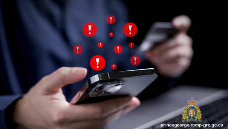 Photo of a person holding a cell phone with red alert images floating above the phone