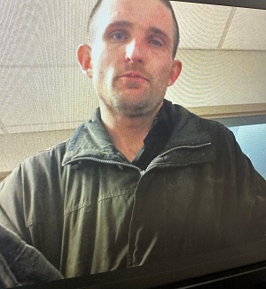 Photo of Matthew Joseph James Holmberg wearing a green jacket.