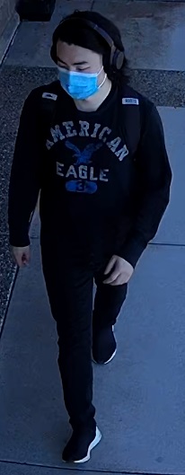Asian male, wearing American Eagle hoody, black pants, blue medical mask, black headphones