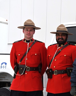 Photo of two RCMP members in red serge