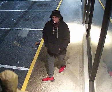 Photo of man wearing black clothing.  The man is a suspect in a theft.