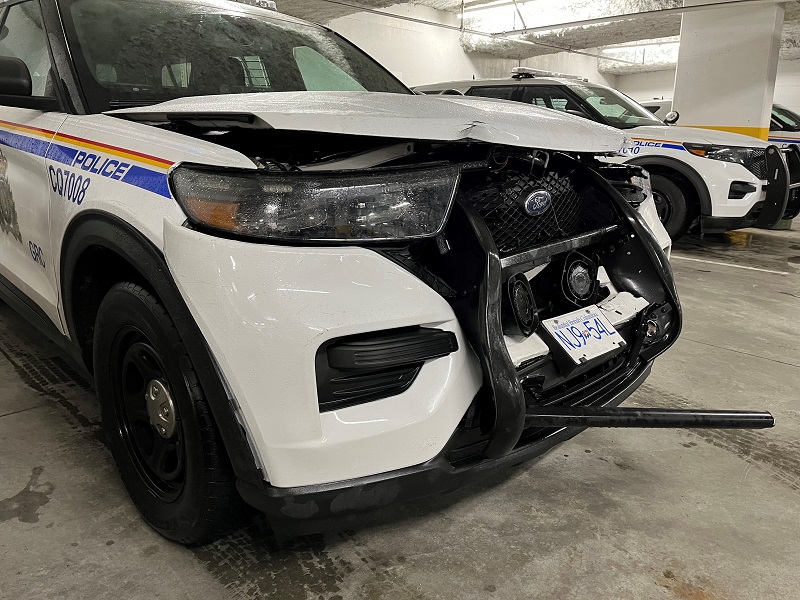 Front-end of a marked RCMP vehicle with significant damage