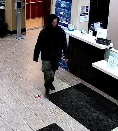 photo of suspect wearing black hoodie and camo pants