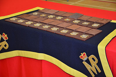 rows of RCMP badges on a table