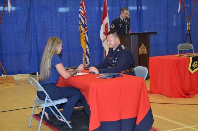 police officer signing employment documents