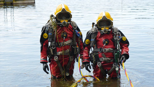 Two divers preparing to deploy