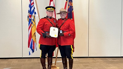 Cst. Derek Ballarin being awarded the Commanding Officer Commendation for his saving of an infant in distress.