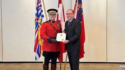 Municipal employee Justin Hazard receiving the Commanding Officer’s Unit Commendation for his role in the Penticton mass shooting of 2019.