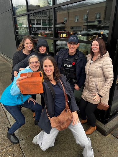 A group of scavenger hunters tracked down Constable Chris Channing of Trail and Greater District RCMP for this photo op