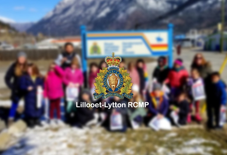 Pictured in the background is a group picture with Cst Ultra and the Cayoosh Elementary School field trip attendee's.